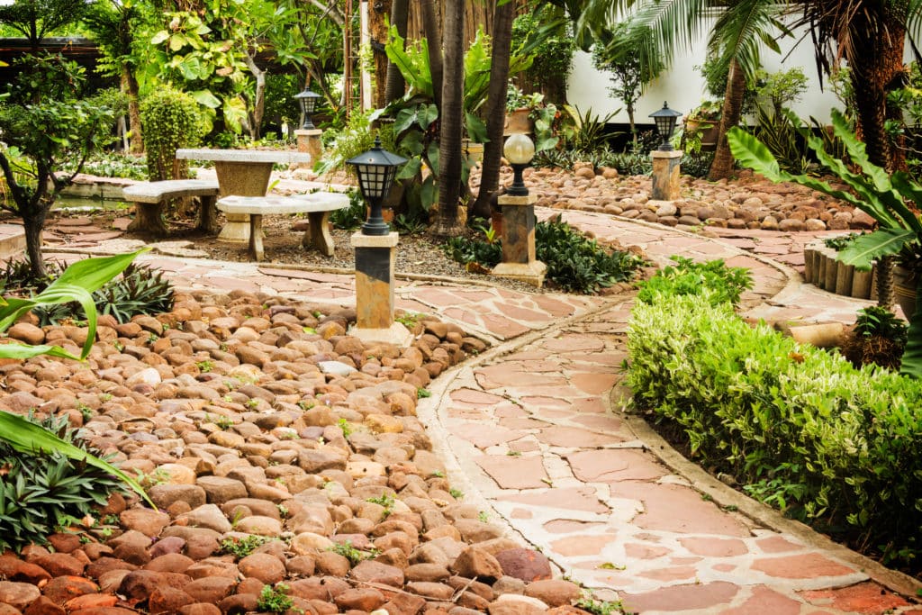 Pathway to residential. Manicured garden design.